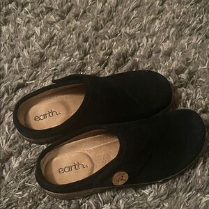 This is a pair of black suede Earth brand clogs or mules like new